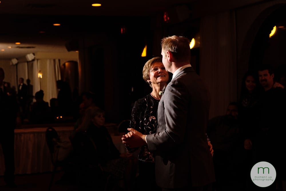 groom dancing with mother