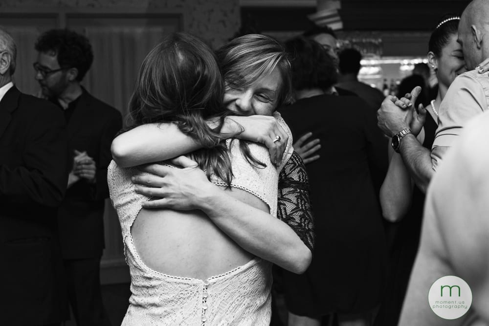 friends hugging on dancefloor