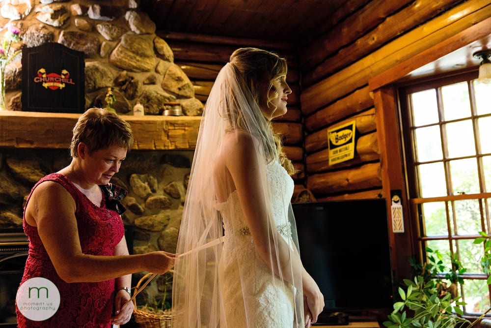 Cornwall Rustic Country Wedding - bride getting dressed with mom
