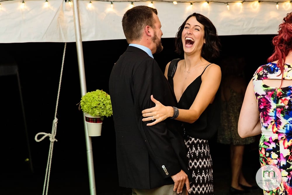 Cornwall Rustic Country Wedding - guest laughing with partner