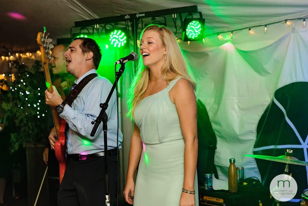 Cornwall Rustic Country Wedding - bridesmaid signing during reception