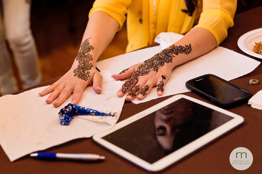 bride's hands and face during mehndi