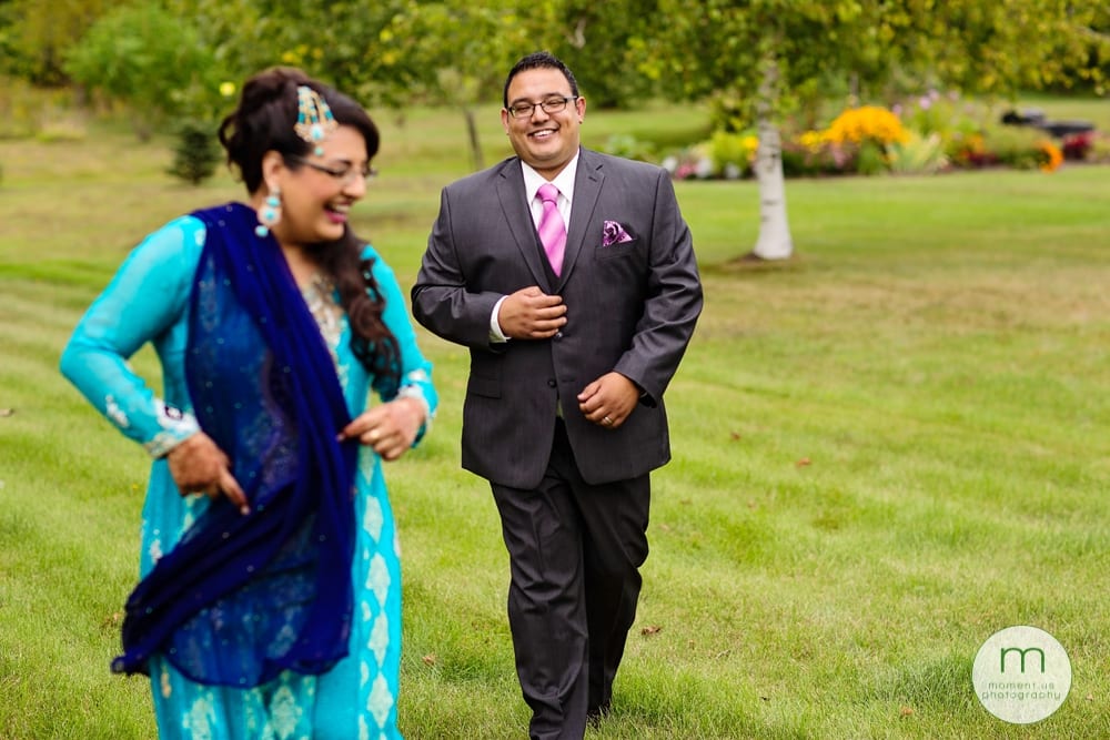 groom laughing with sister