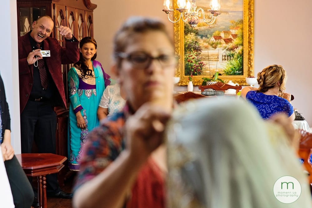 bride's father watching her get ready