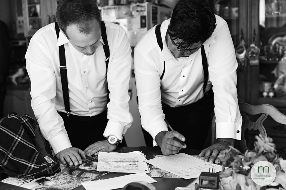 groom and groomsmen reviewing speech