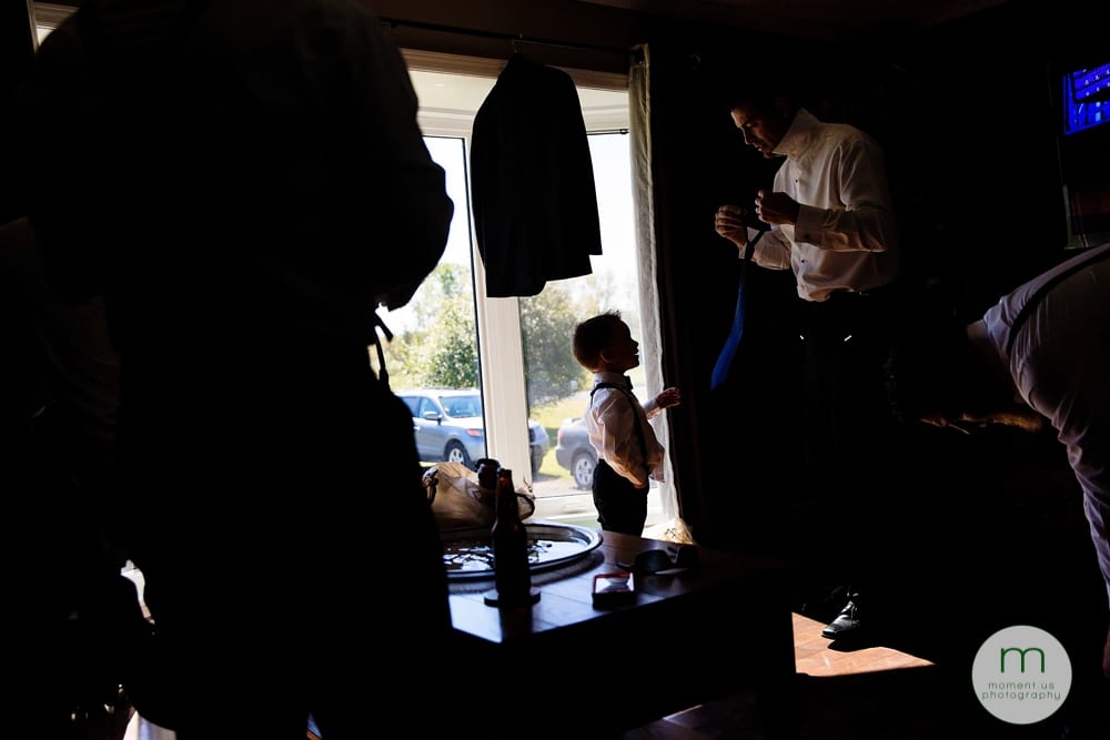 ring bearer getting dressed