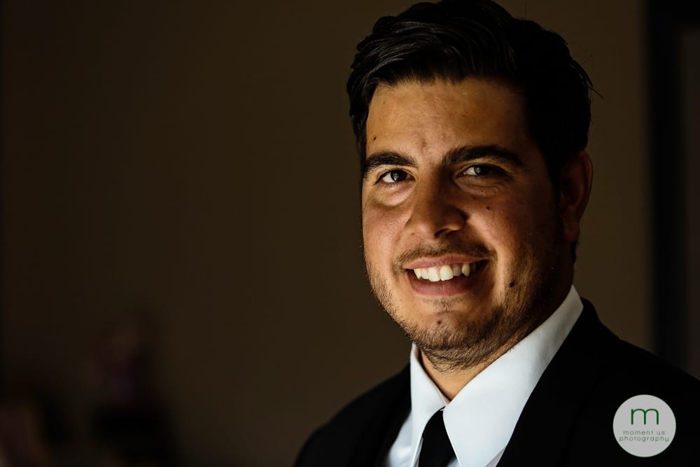 groom looking at camera