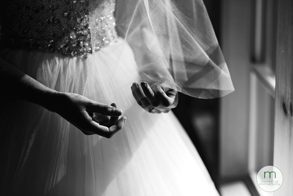 bride fiddling with veil