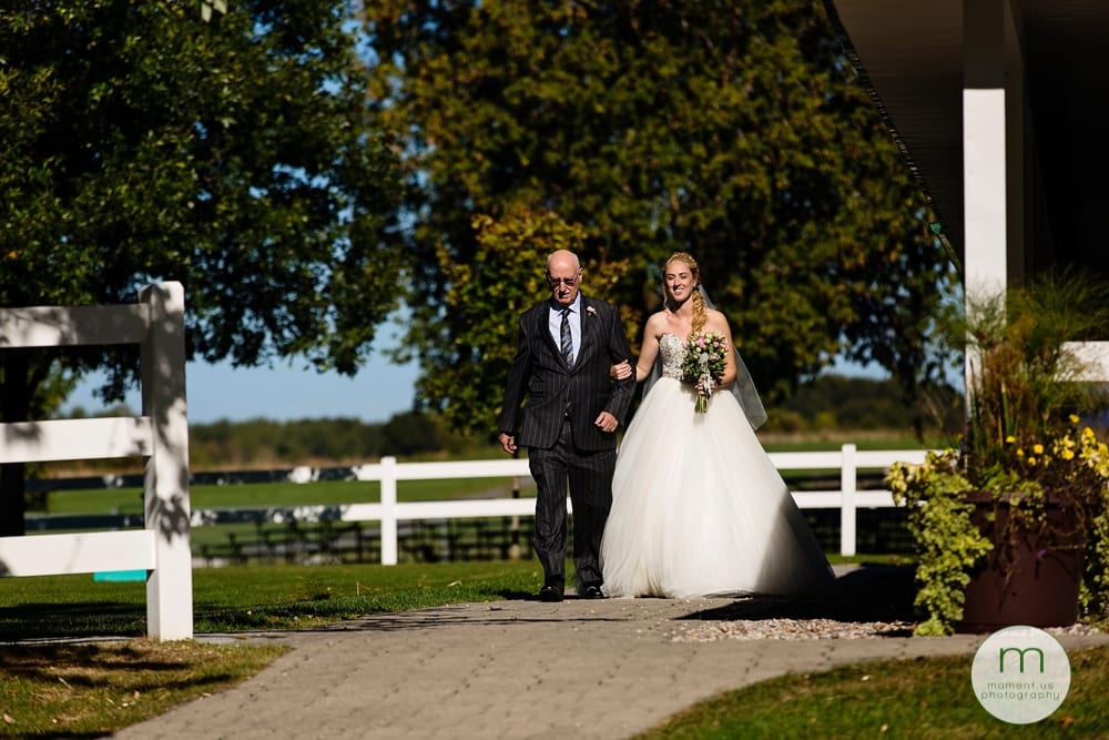 bride and father walking down aisle for Maxville Fairground wedding 