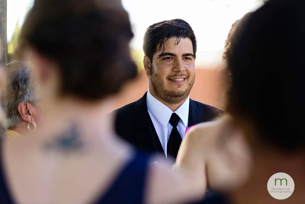 groom looking at bride