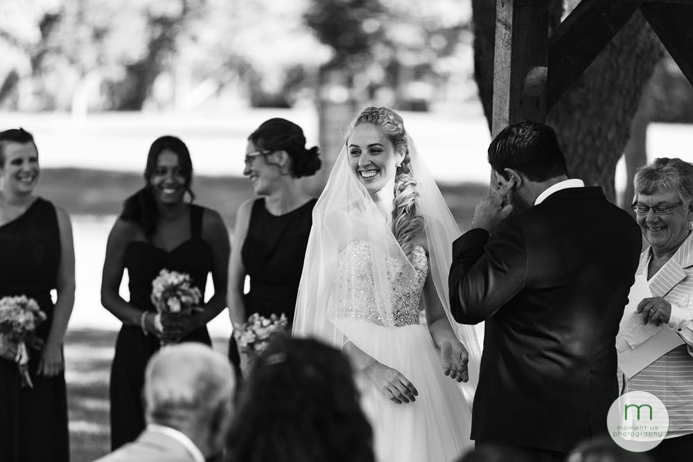 groom plugging his ears during Maxville Fairground wedding 