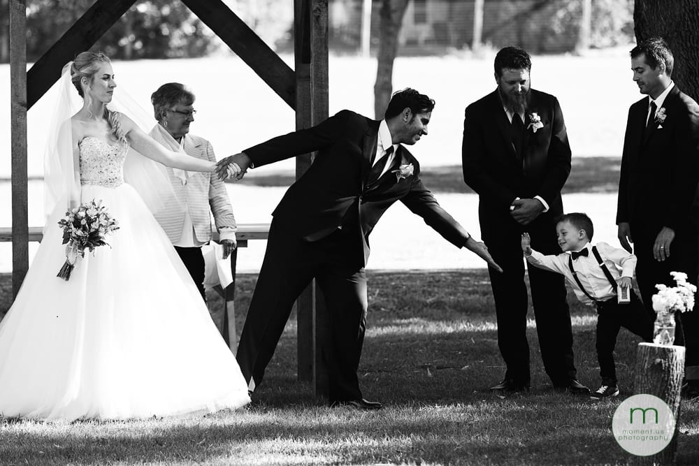 groom getting high five from ring bearer