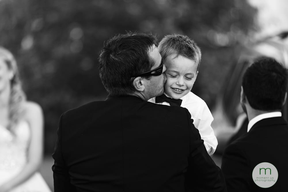 groomsman kissing son