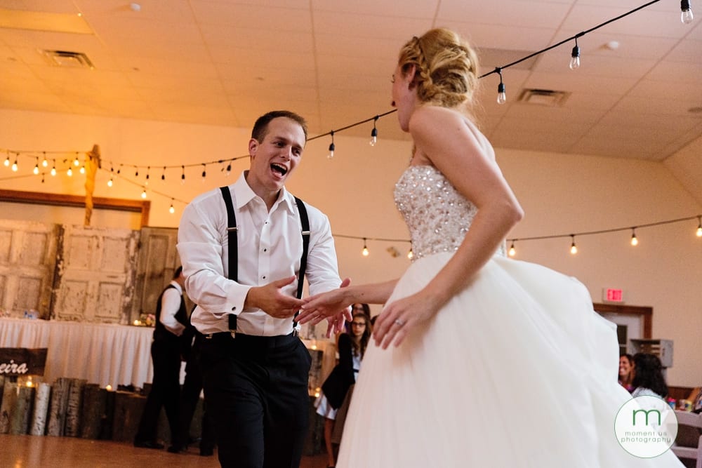 groomsman dancing with bride