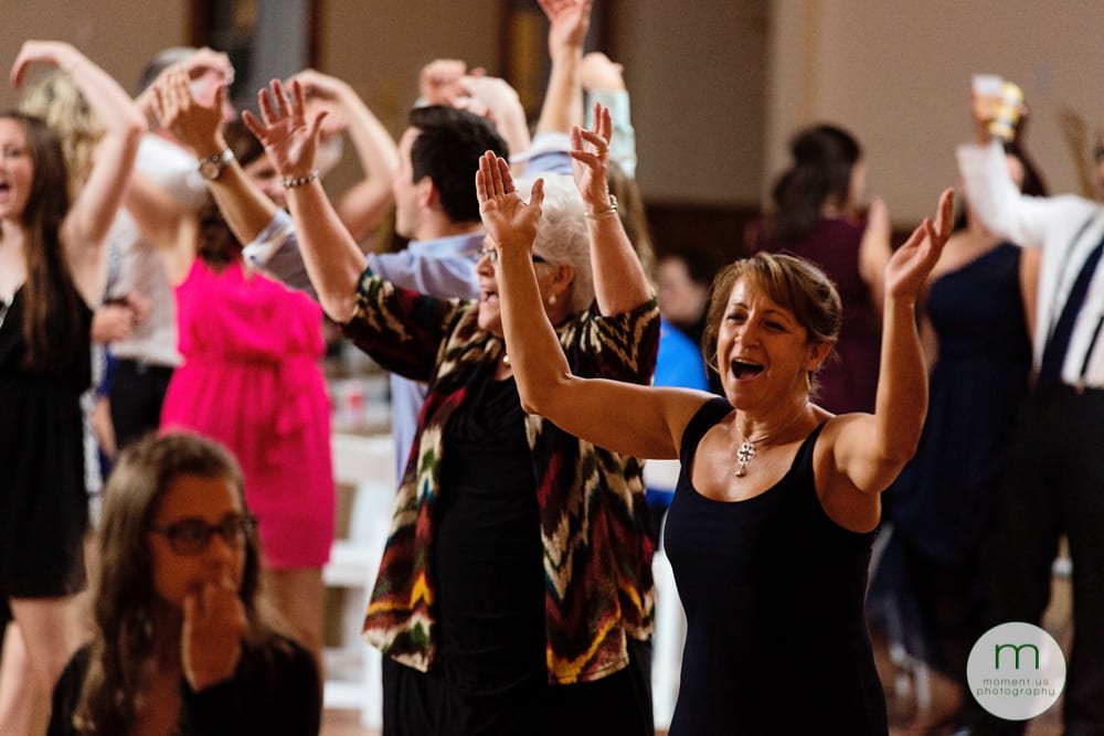 women dancing with hands in air