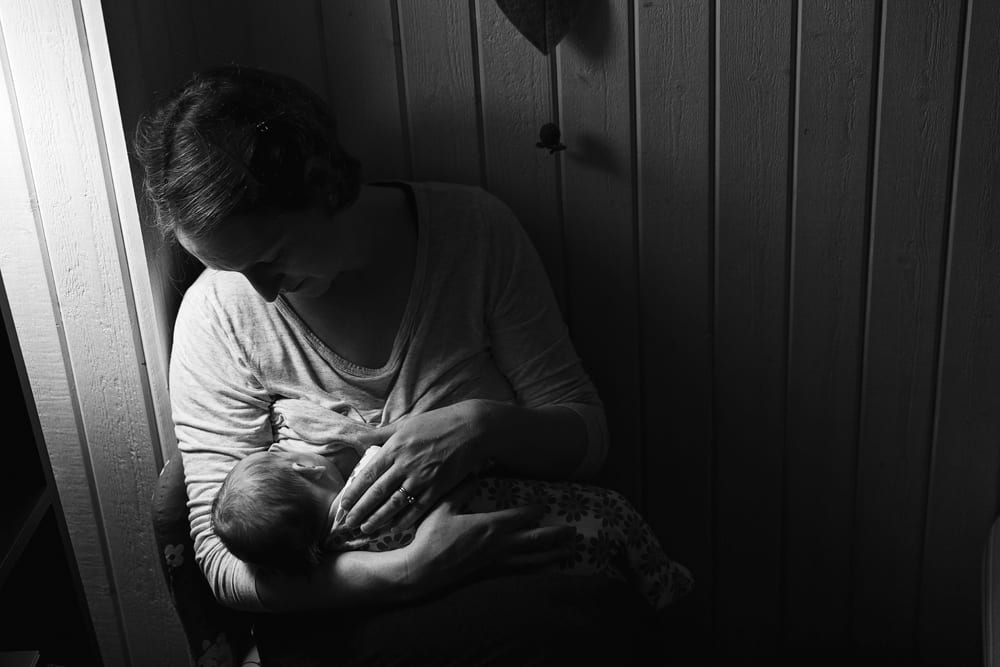 Stockholm mom breastfeeding at bedtime