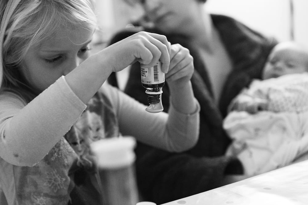 Stockholm girl measuring out drops