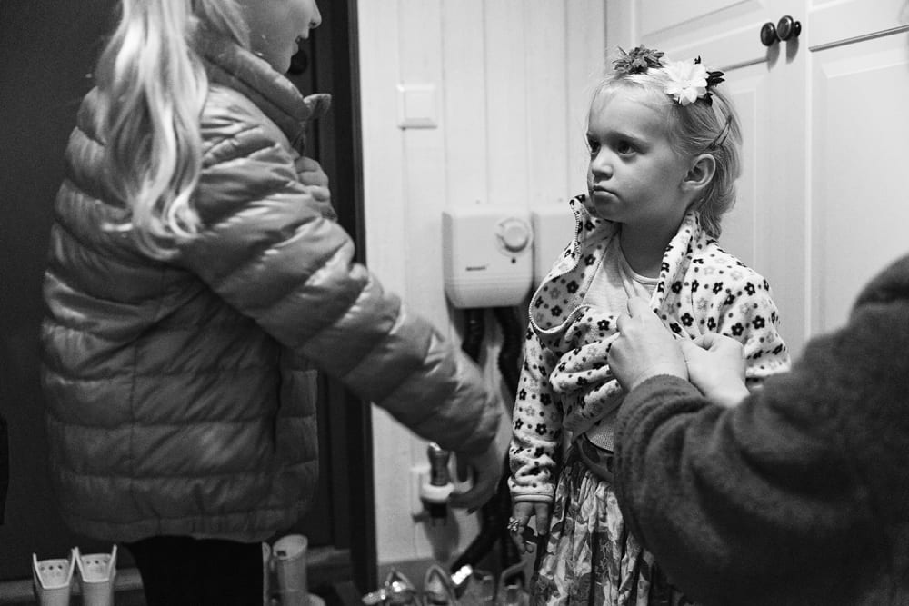 Stockholm girl getting coat zipped