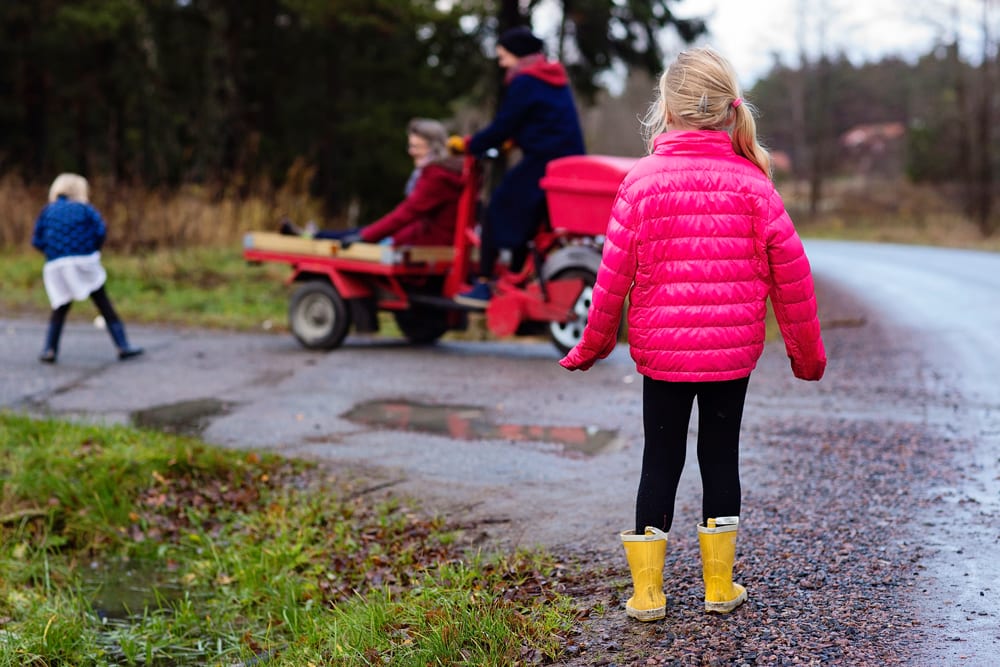 Stockholm girl watching family arrive at school 