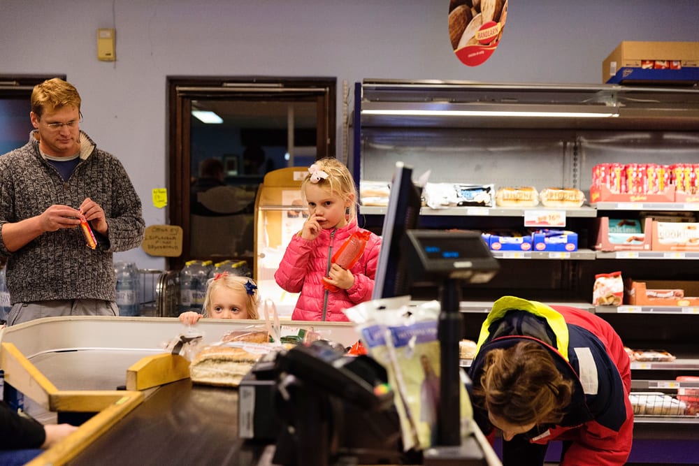 Stockholm family waiting for groceries at check out