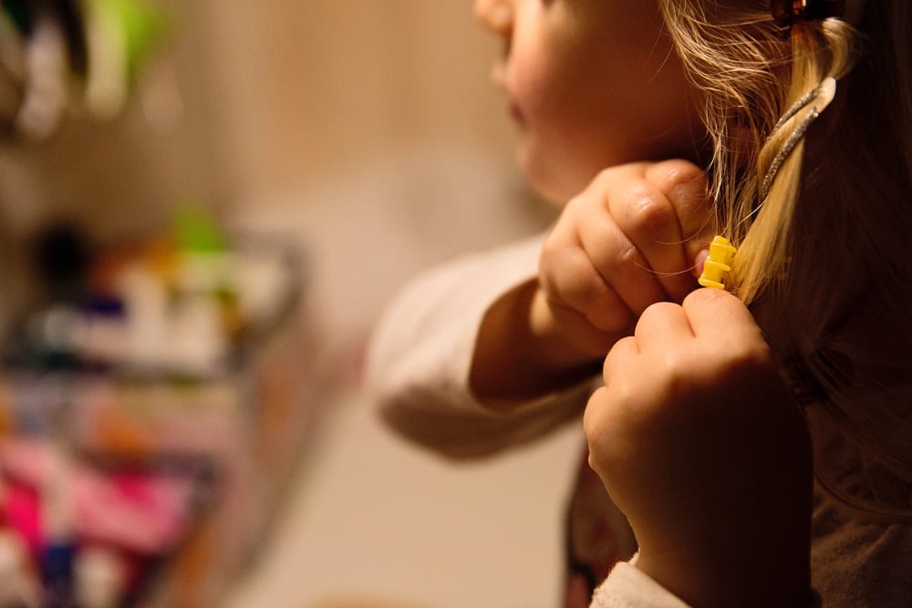 Stockholm girl playing with hair clips