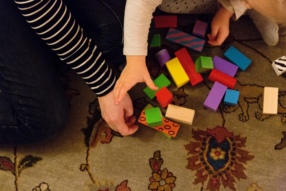 Stockholm mom and daughter playing with blocks