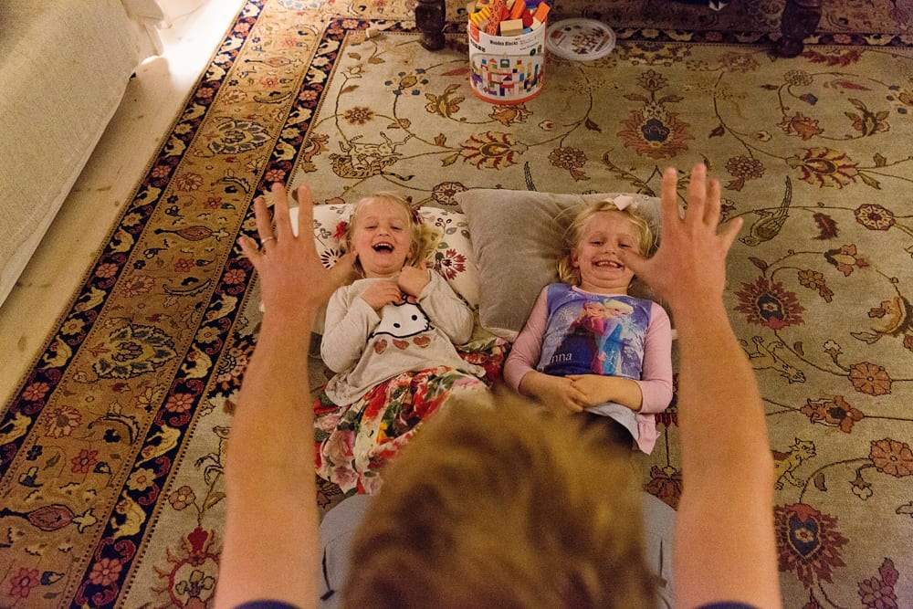 Stockholm family playing tickle game