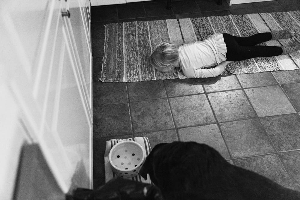 Stockholm girl lying on floor looking at mousetrap