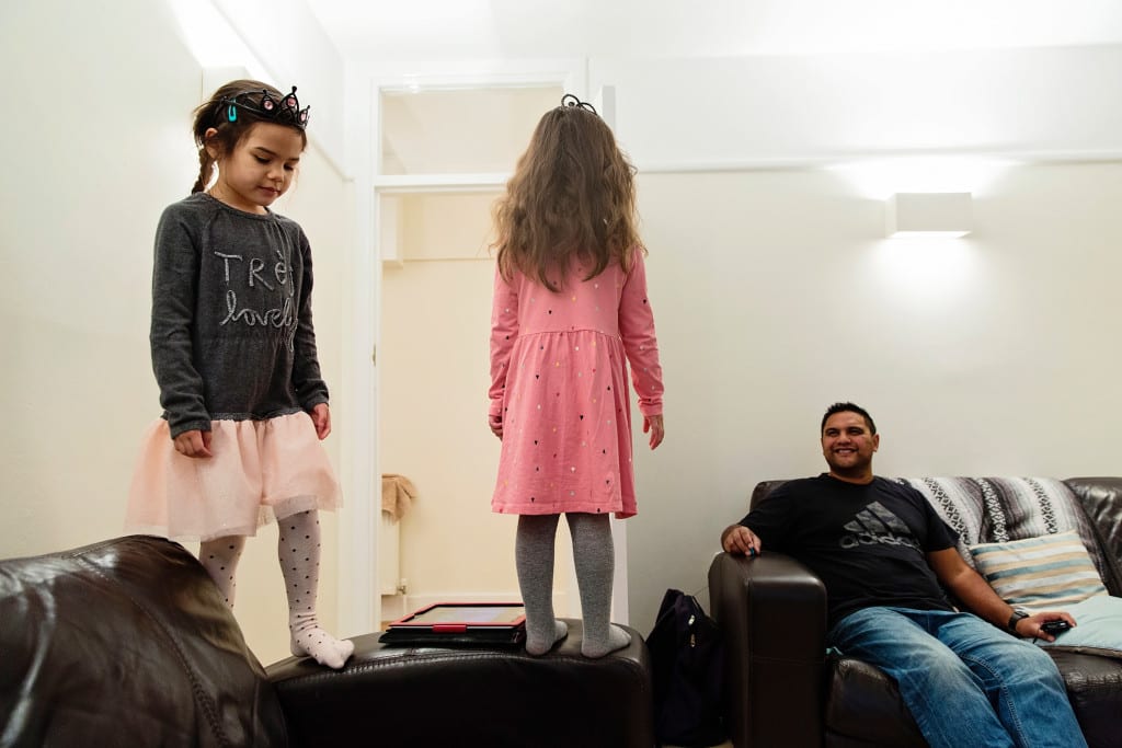 girls standing on couch