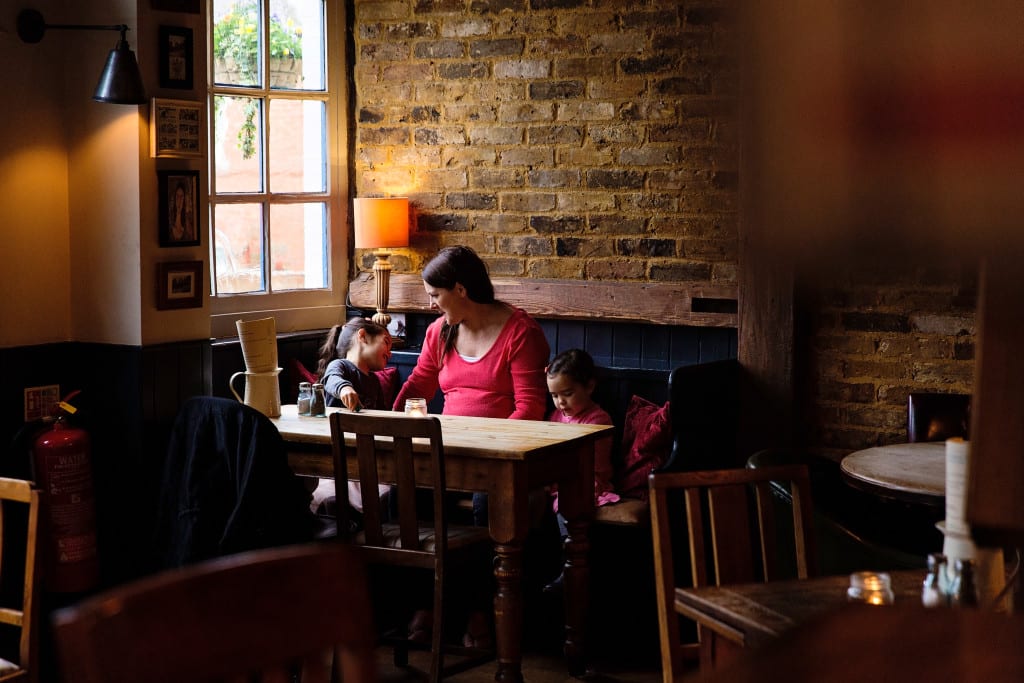 London family in pub by window