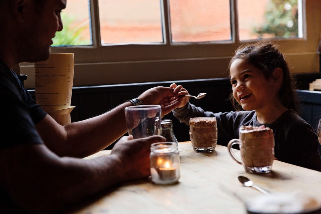 London father and daughter with hot chocolate