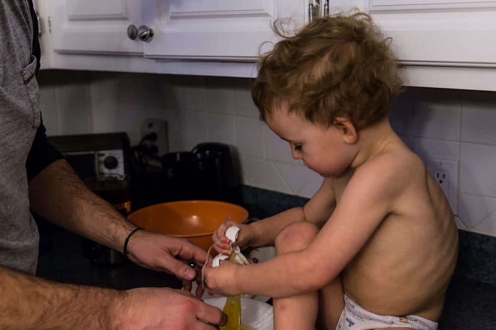 Cornwall family photography - making a mess of egg
