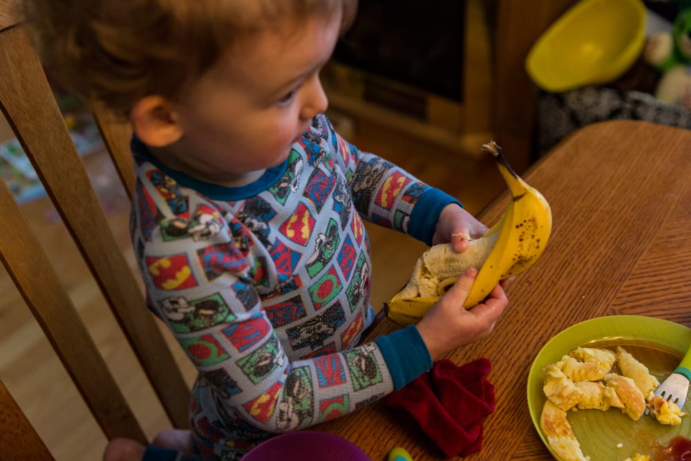 Cornwall family photography - weird way to open a banana