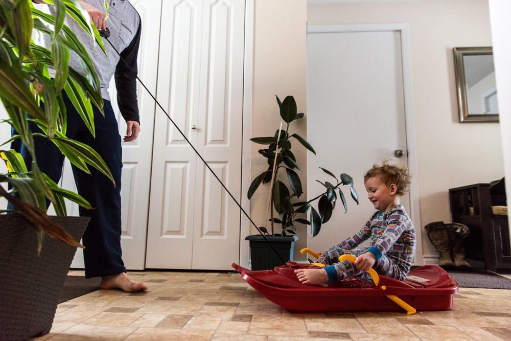 Cornwall family photography - dad and son indoor sledding