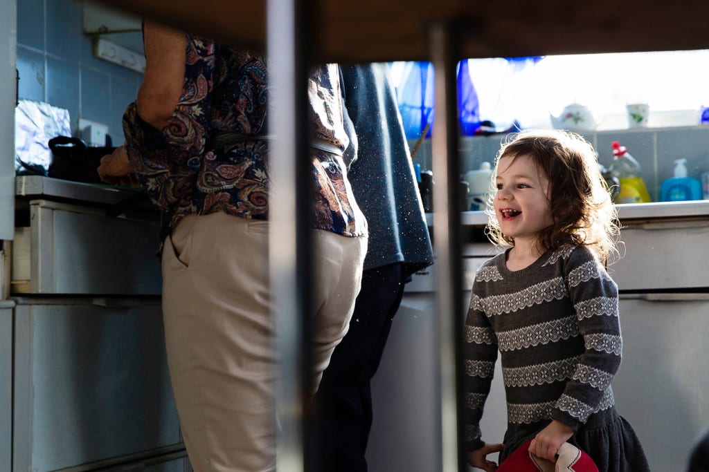 Granddaughter at play during prep for Manchester family lunch