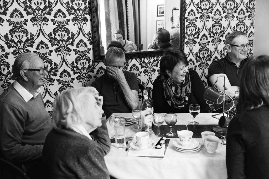 Family laughing during lunch