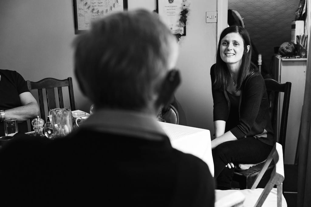 Grandfather and granddaughter-in-law during Manchester family lunch