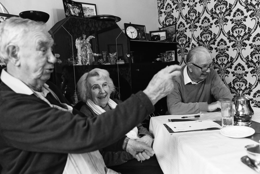 Wife and brother laughing during Manchester family lunch