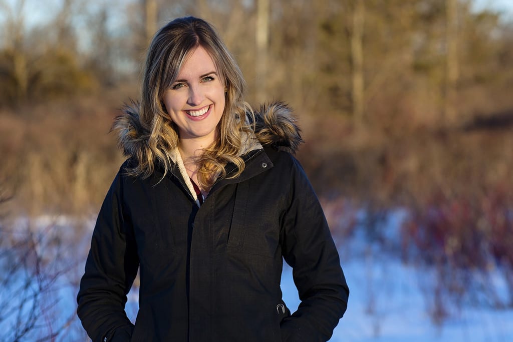 Woman with hands in pockets