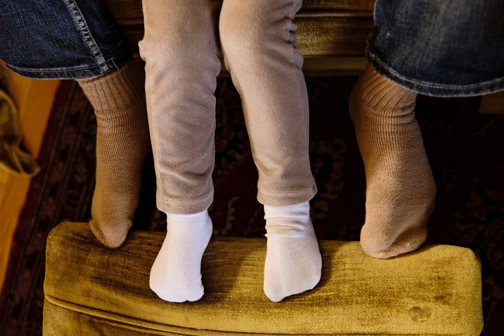 Cornwall family photographer - dad and daughter feet