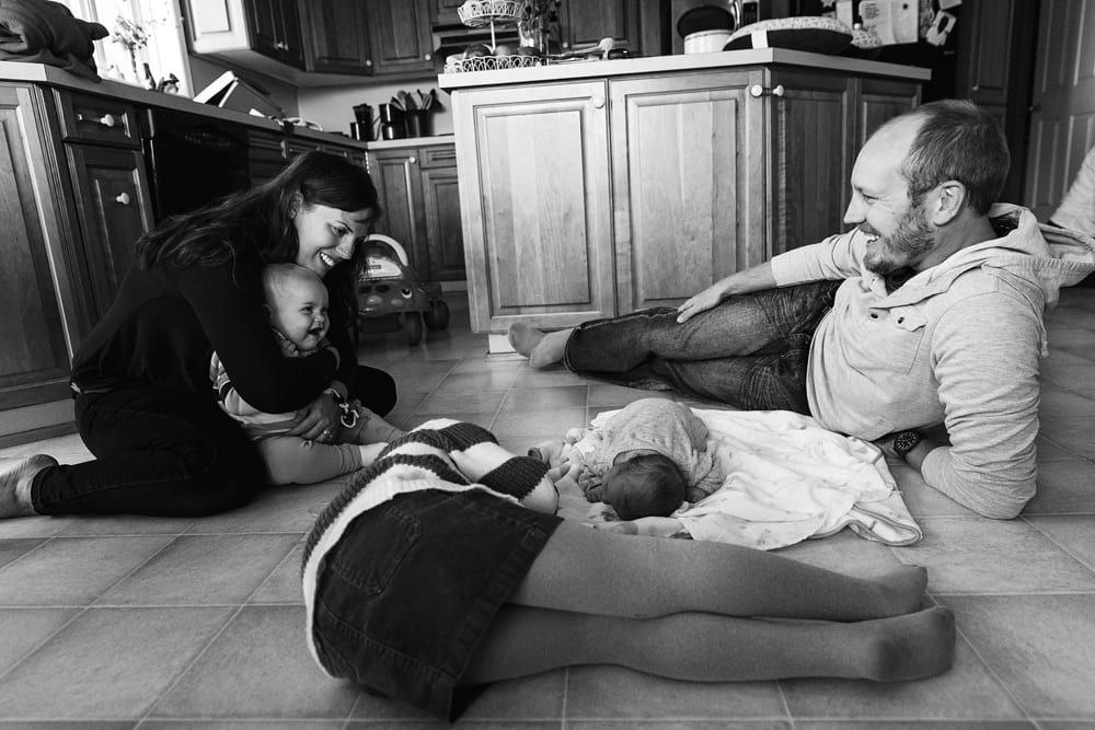 Cornwall family photographer - family on kitchen floor