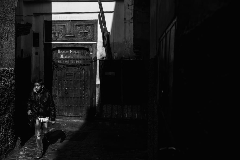 Wedding photographer in Morocco - boy walking to school in Marrakech