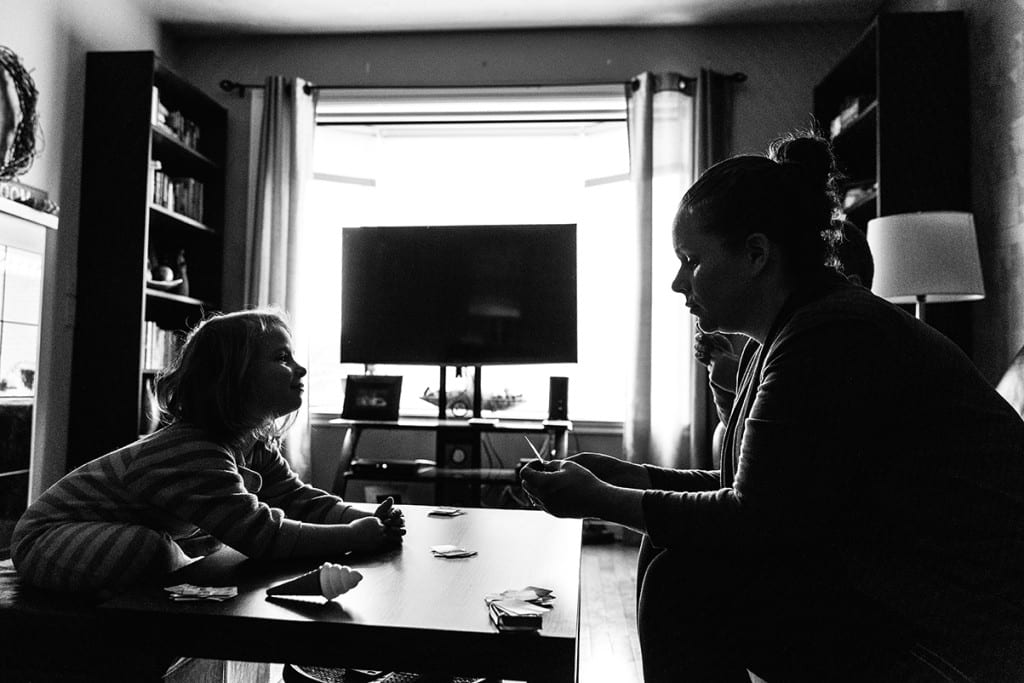 mom and daughter playing cards