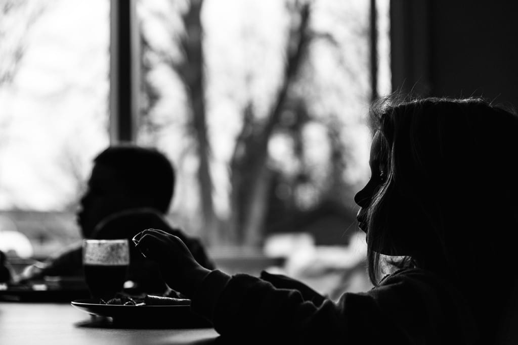 kids silhouetted at breakfast table