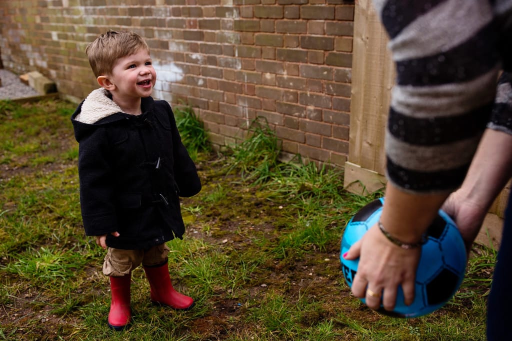 boy and mom playing with ball