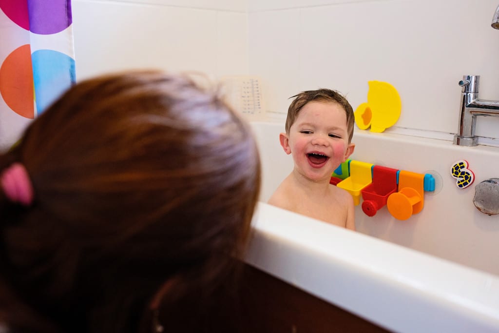 mom playing peek during South Wales family session