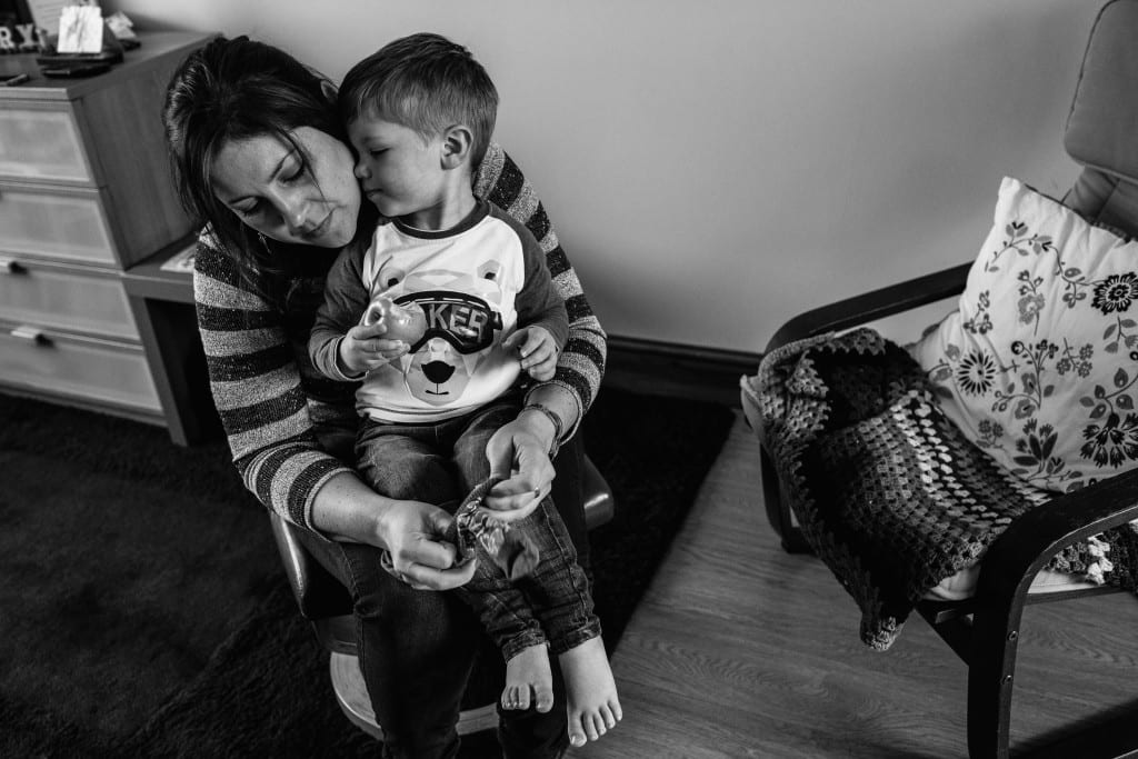 boy snuggling mom during South Wales family photo session