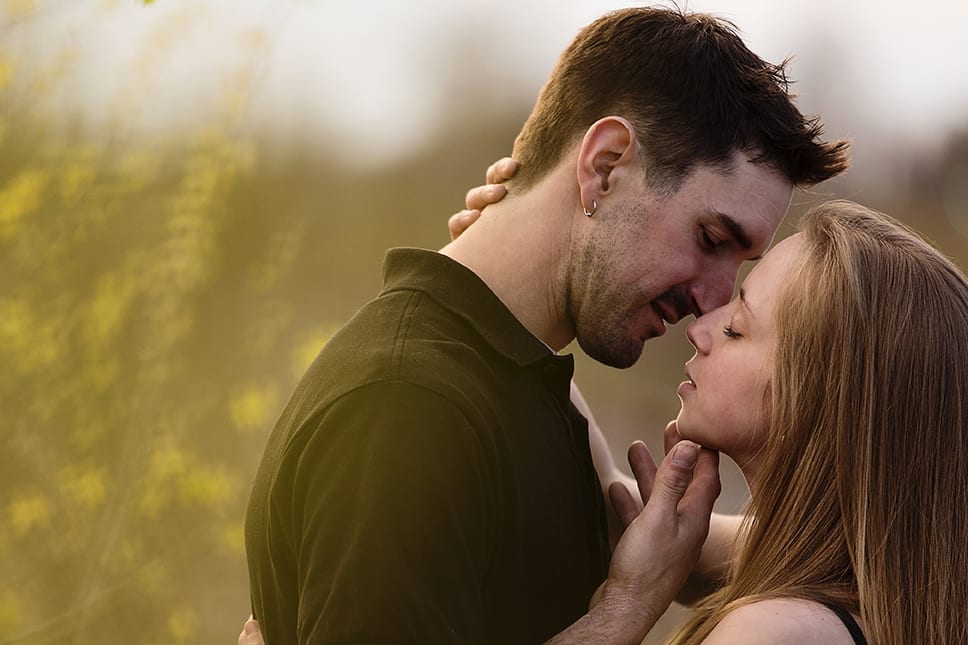 man about to kiss woman during Cornwall engagement session