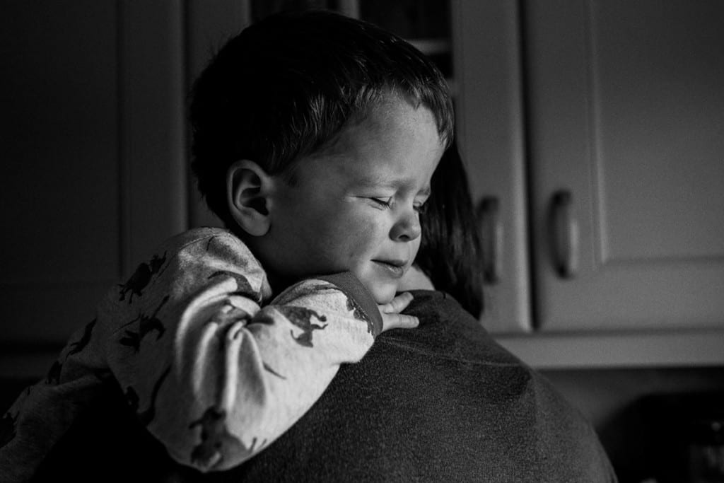 boy hugging mom