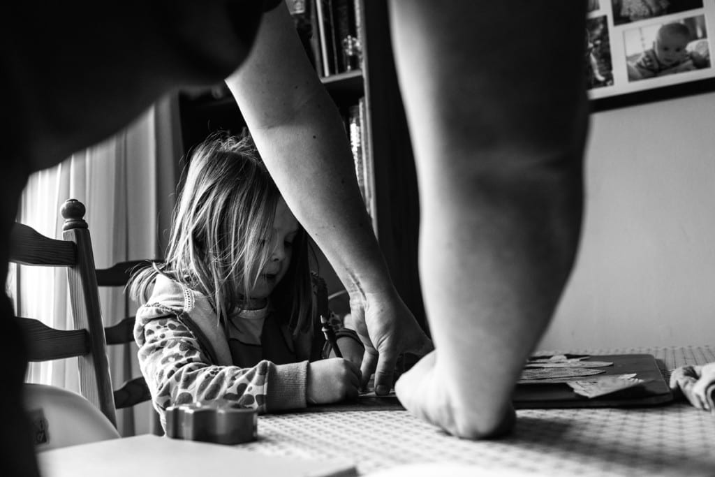 girl doing art project during London family photography session
